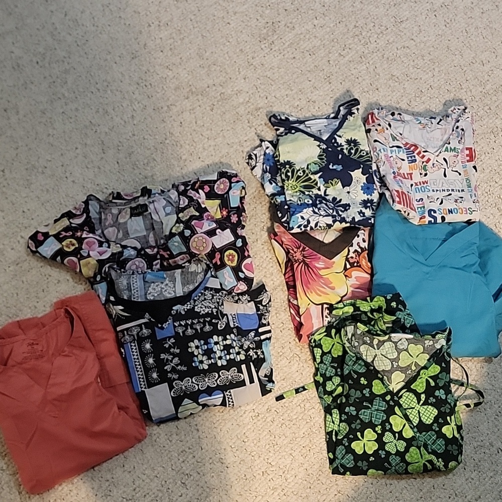8 pair of scrub tops. Mostly small and x smalls